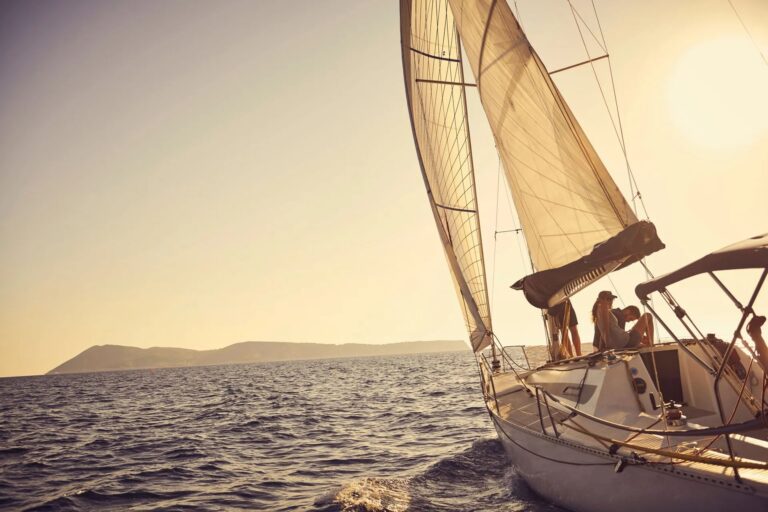 From Gouves Port: Sunset Sailing Trip to St. George Bay
